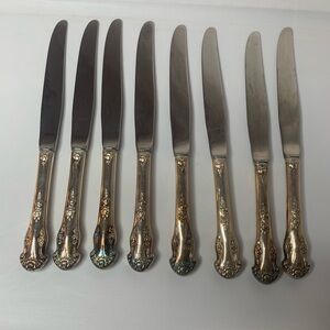 vintage 1951National Silver Co. set of 8 dinner knives stainless Holiday pattern